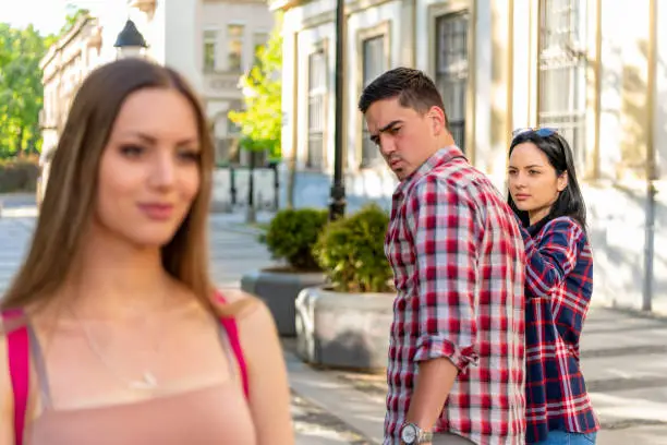 a group of people walking down a street